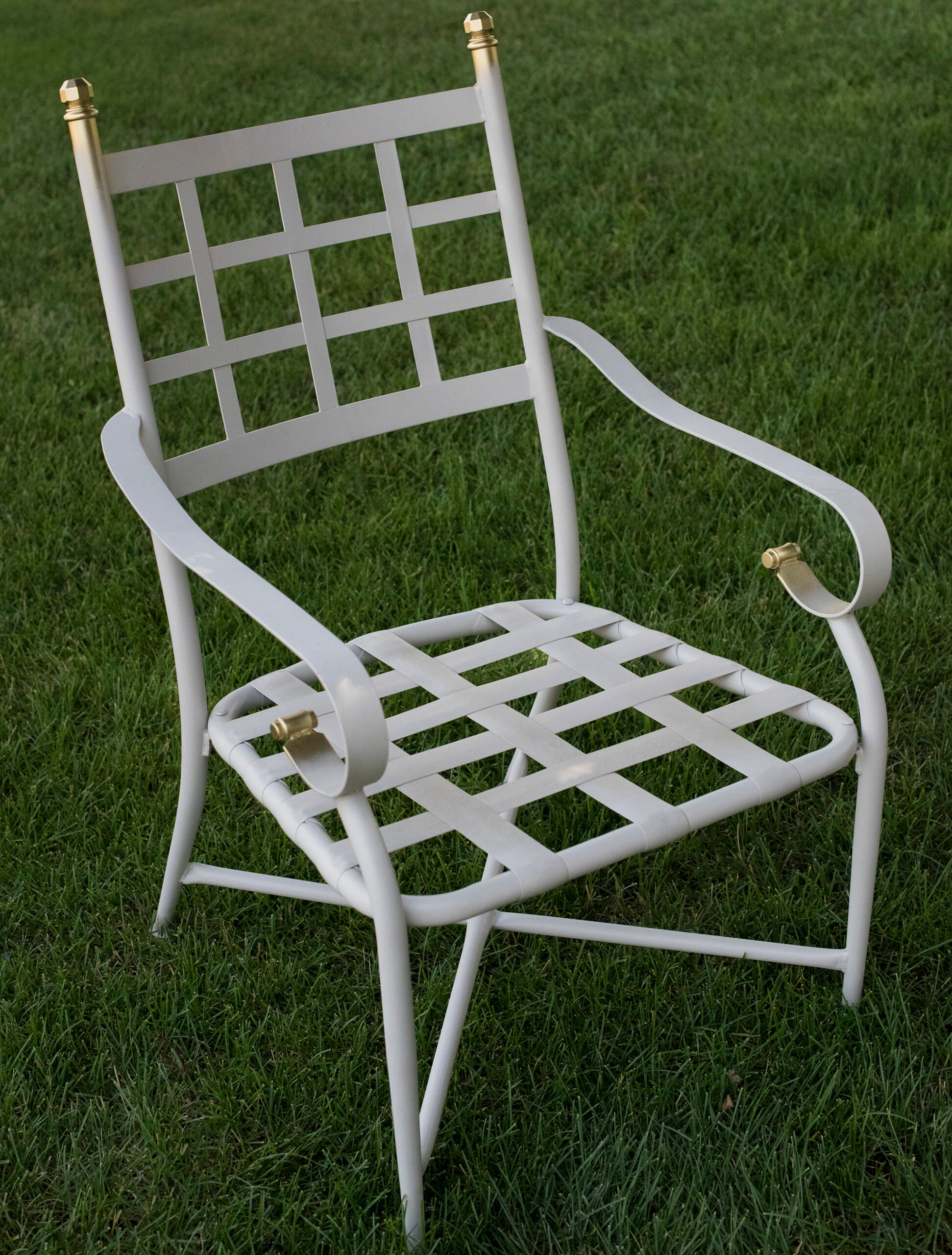 Adding gilding to an iron patio chair with gold leaf spray paint