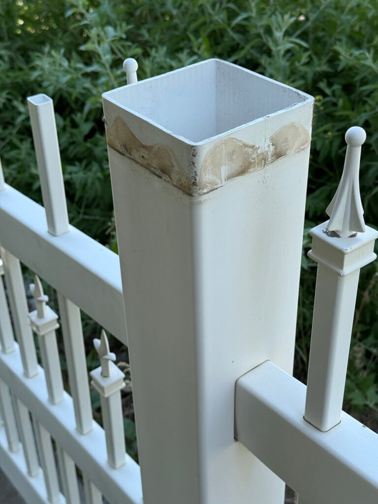 Before image of a fence post with a missing finial or post cap that is dirty and ugly.