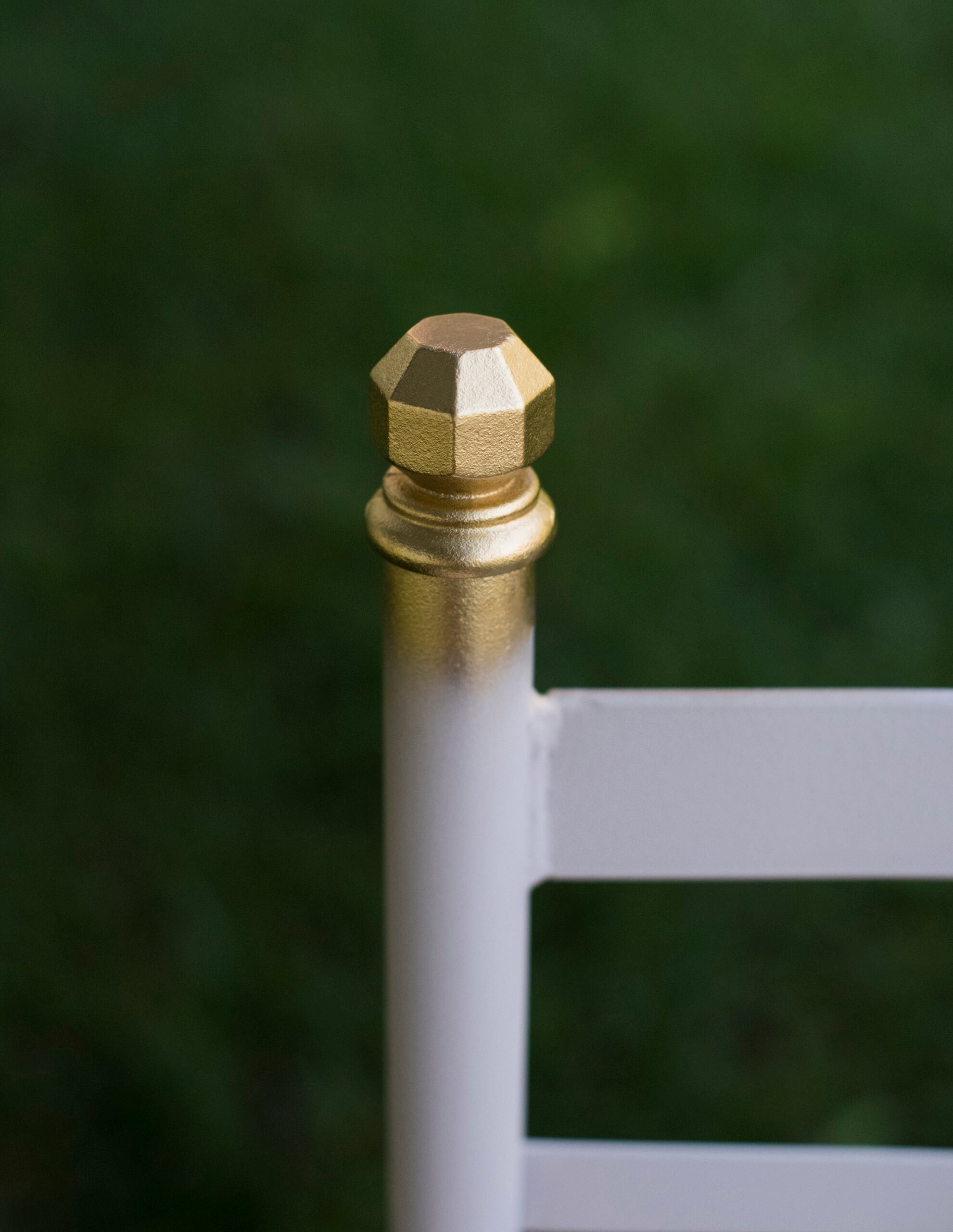 Gilded finial on patio chair with gold leaf spray paint
