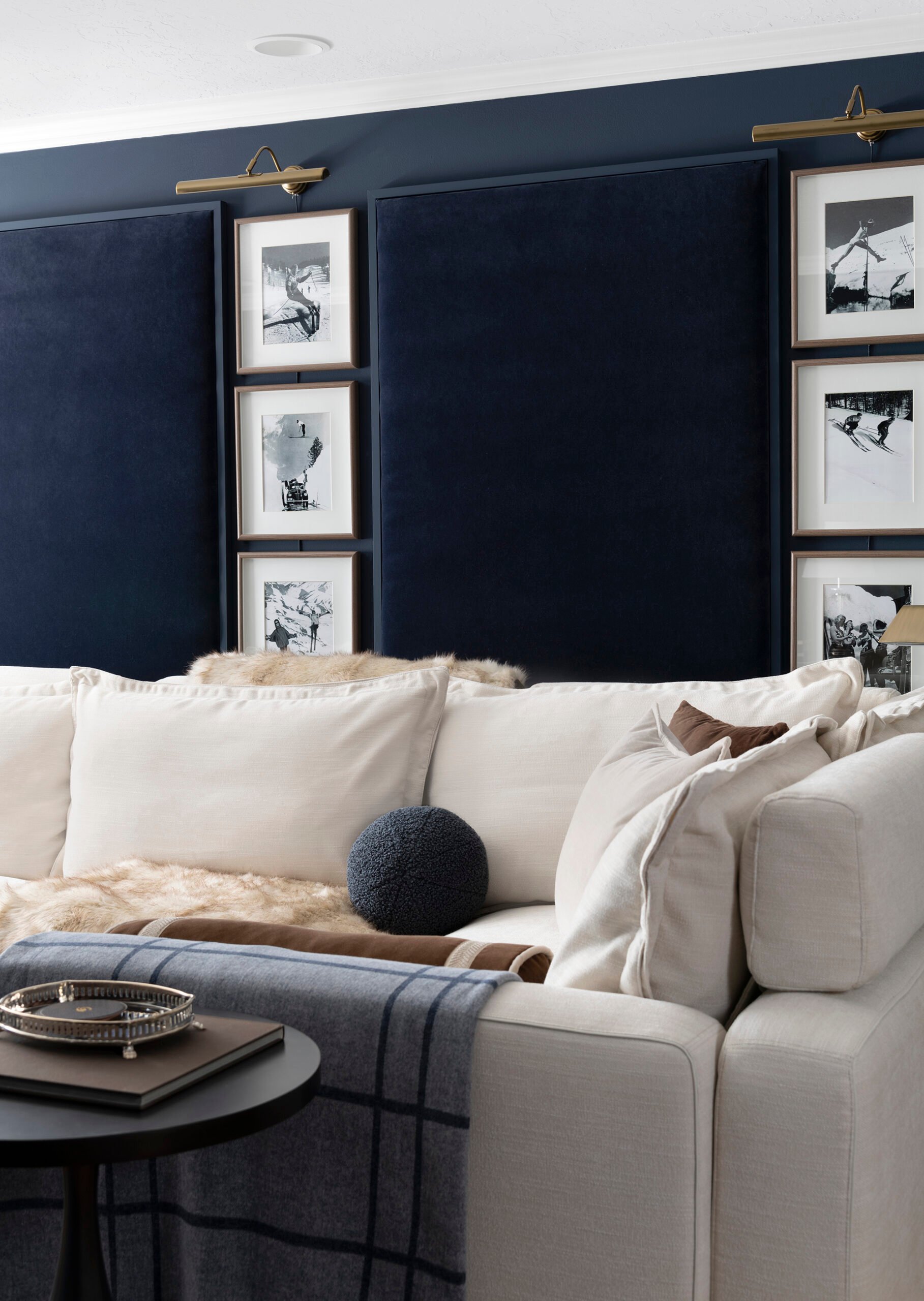 Navy upholstered velvet acoustic panels in basement media room with sofa sectional