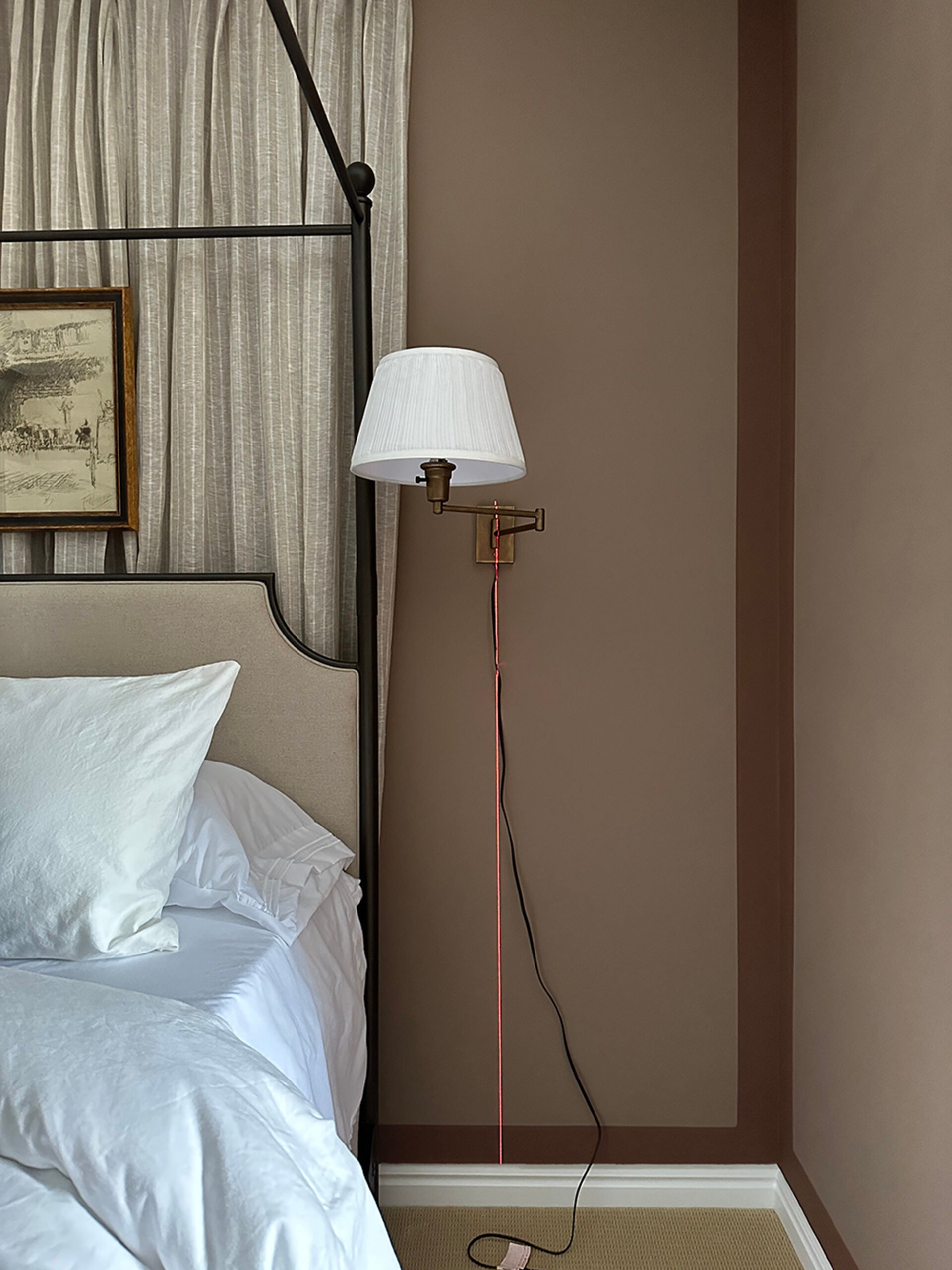 Laser level beam for concealing cord chase over a loose and unruly sconce cord