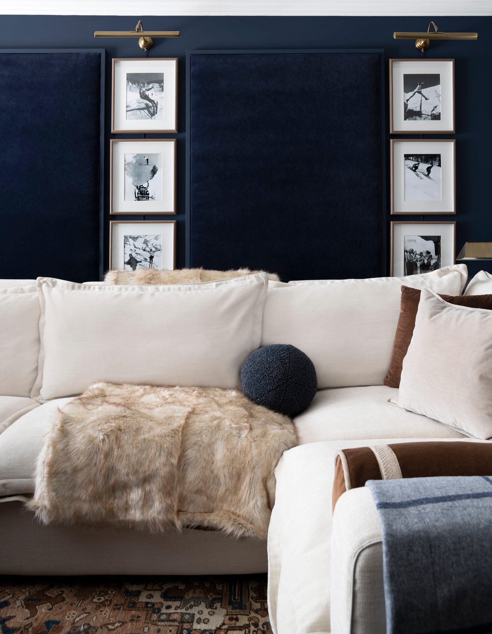 Navy velvet acoustic wall panels in a basement media room