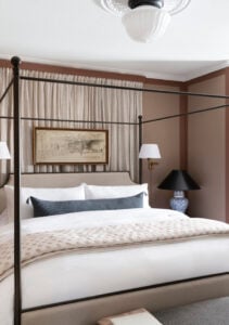 Canopy bed from Wayfair with white bedding and soft drapery