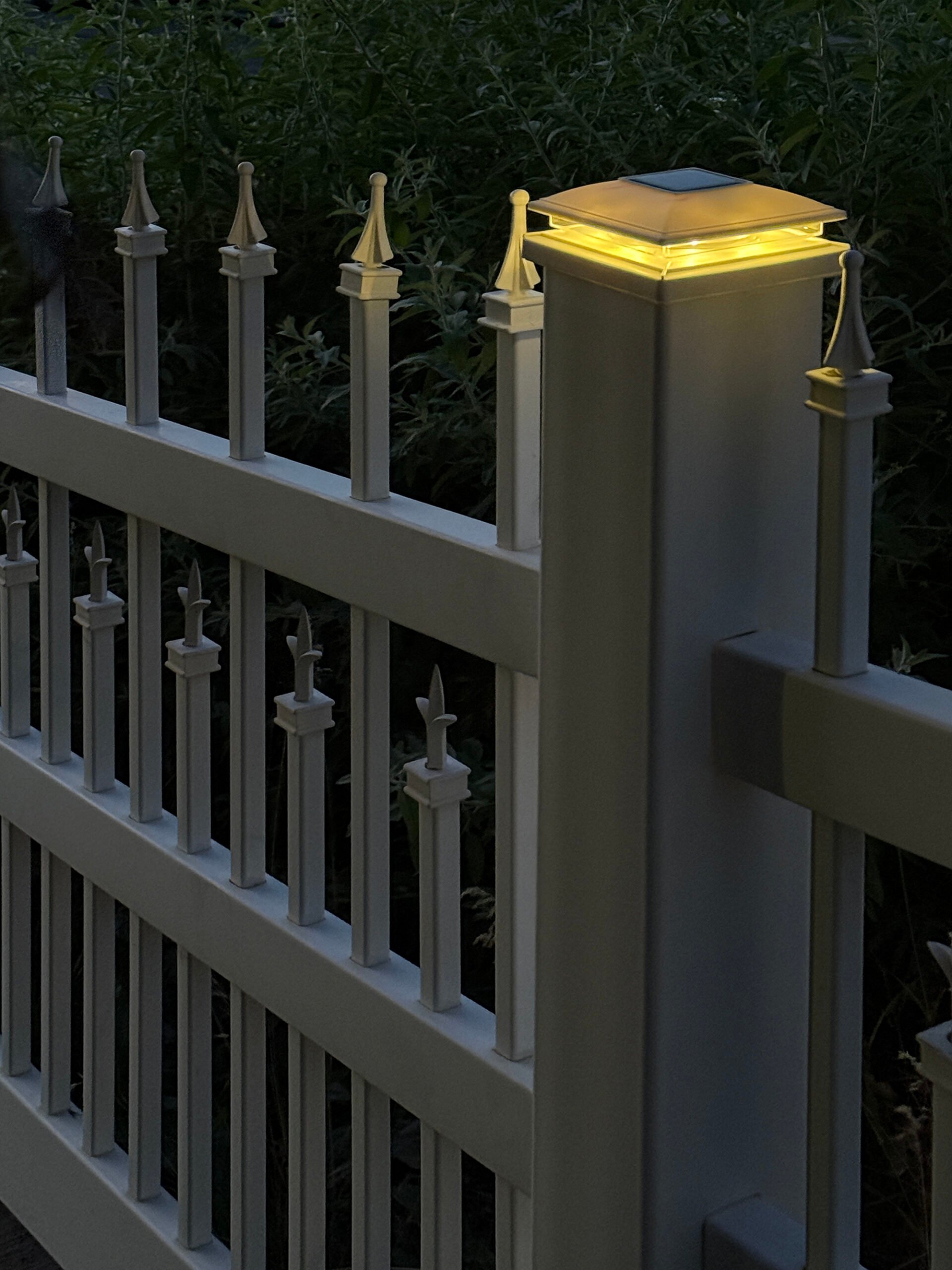 Illuminated solar fence post cap light for a classic and colonial look.